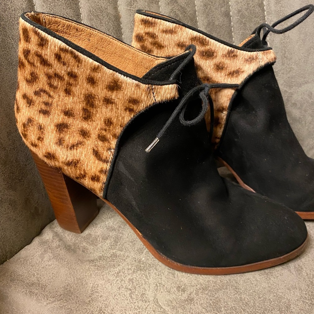 Woman’s cheetah print madewell booties.